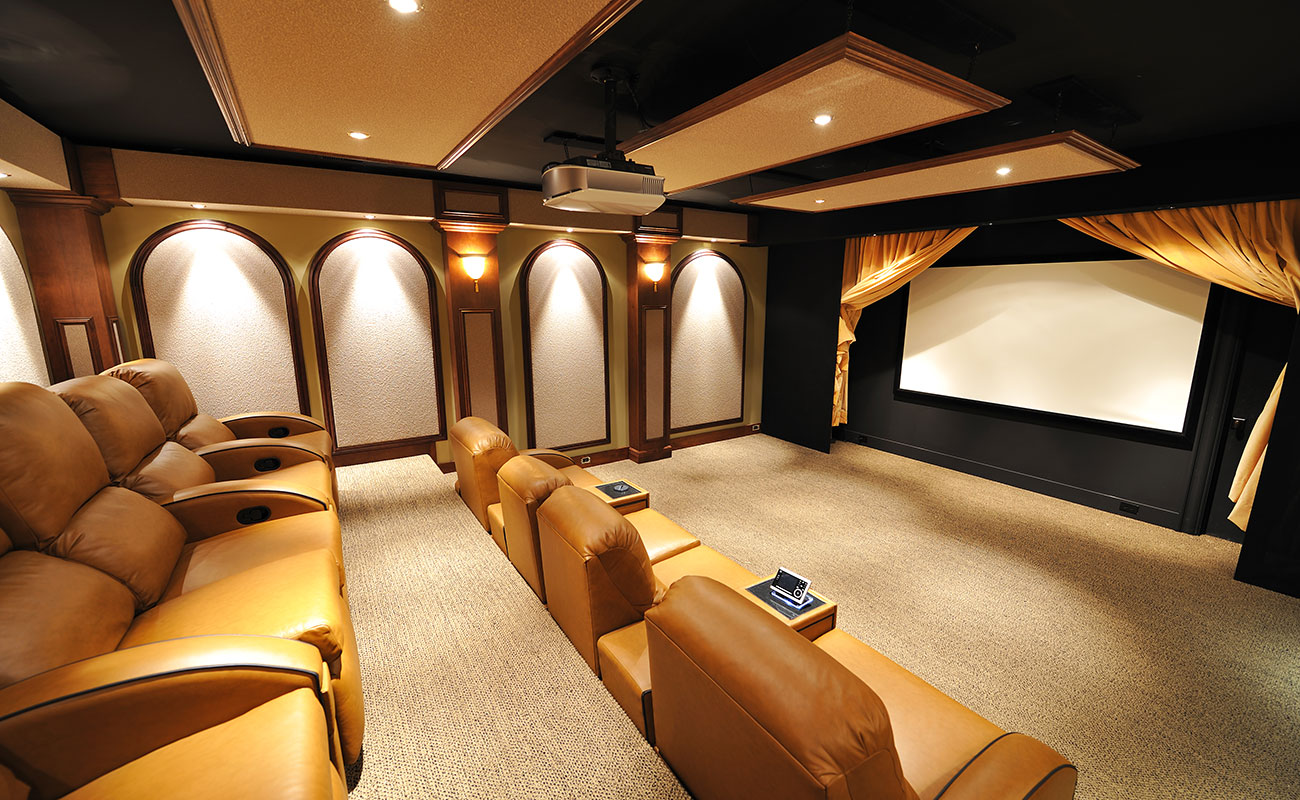 High-end home cinema room with wide screen 