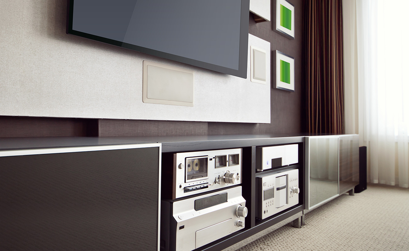 Consoles and audio systems under a plasma tv