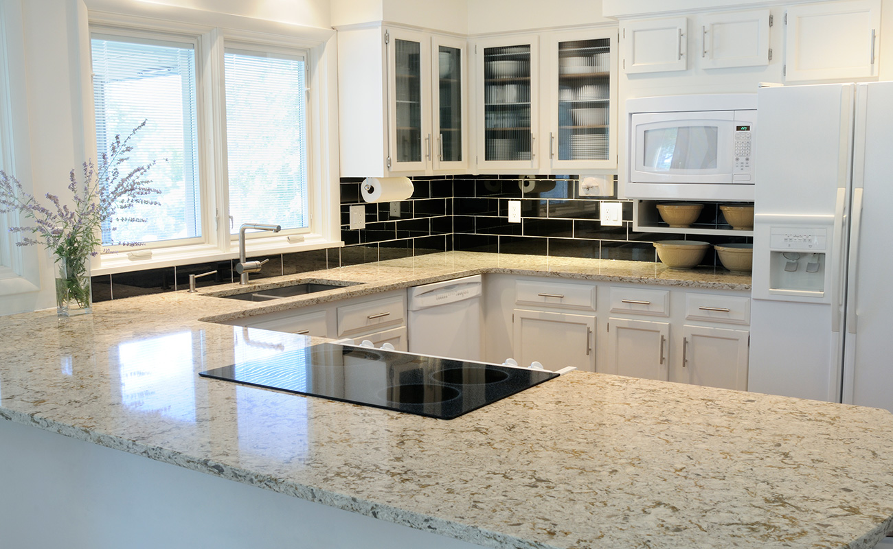 Light coming in through windows to light kitchen countertop