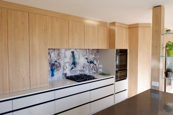 kitchen with wooden cabinets and print splashback