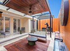 House exterior with large turquoise pool