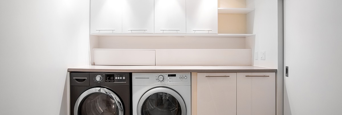a basic laundry room with washer and drier