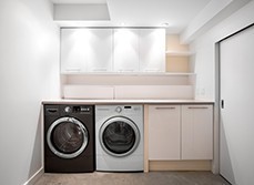 a basic laundry room with washer and drier