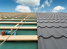 Corrugated iron roof being installed