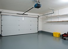 Basic garage renovation with painted floors and basic shelving