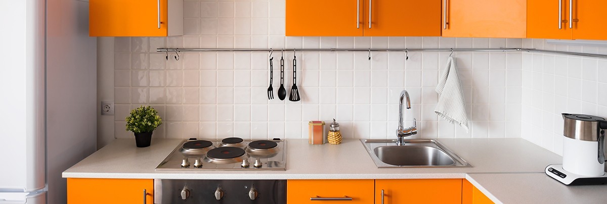Basic home kitchen renovation with orange cabinet, basic appliances.