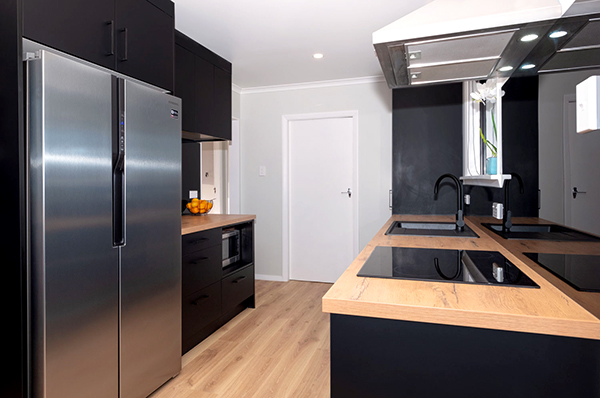 After its renovation, the kitchen of this 1950s home looks nothing like it had.