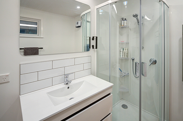 Functional and fresh, the new designs for this property's bathrooms and laundry room have provided smarter layouts with a clean look.