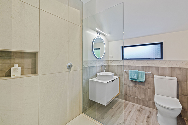 This bathroom renovation modernised the room with a compelling design and maximised the use of available space.