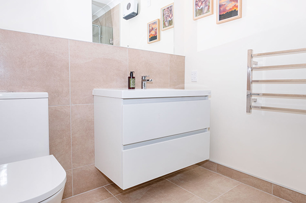 From cold and dated to warm and modern, these bathrooms underwent complete renovations, resulting in much more comfortable and functional space.