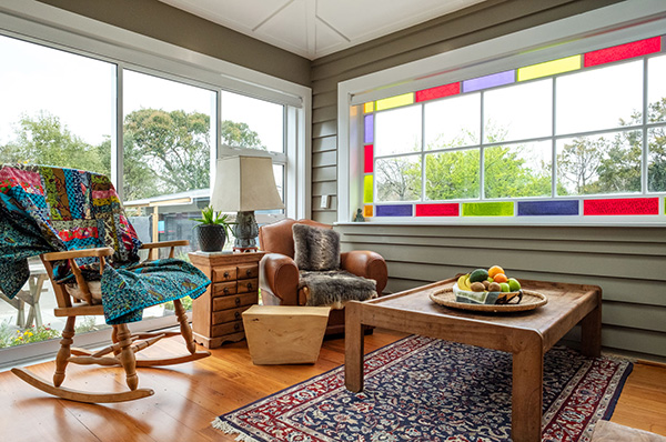 This multi-purpose sunroom is light, bright, and spacious, adding modern functionality to an 1800s home.