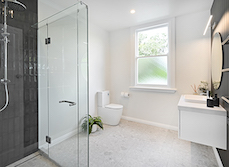 Bathroom with round mirror
