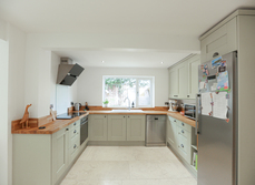 A brand new kitchen that is open plan with lounge and snug area
