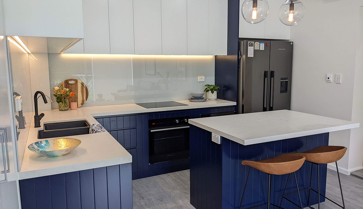 Navy blue kitchen with under lighting