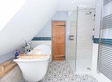 A chic family bathroom and WC design for a rustic farmhouse renovation in Cambridge