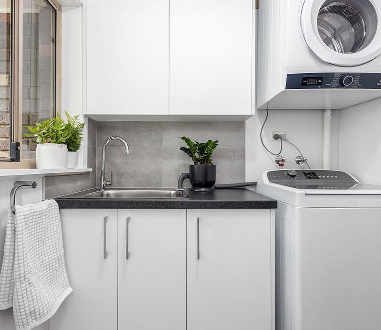 From bog-standard to sleek and modern, this property's bathroom and laundry room underwent a surprising transformation.