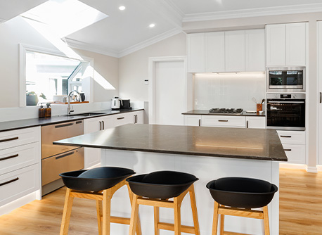 kitchen with white cabinets and wooden floor