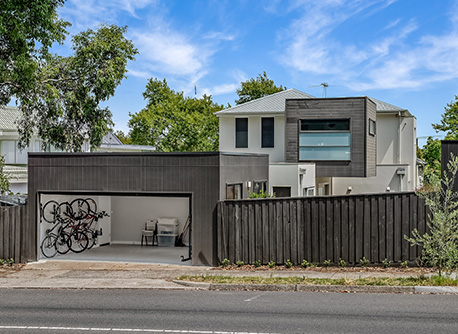 Brown wooden fence and garage