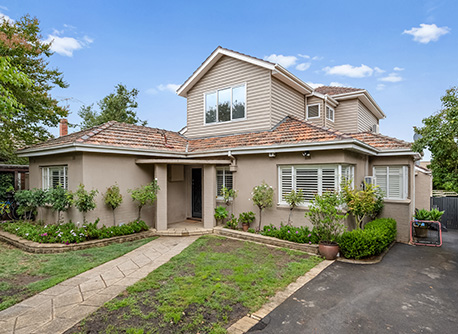 A beige two-storey house