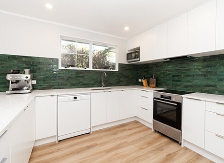 Kitchen with green tiles