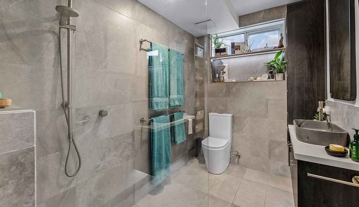 modern condo bathroom remodel with greige tiles