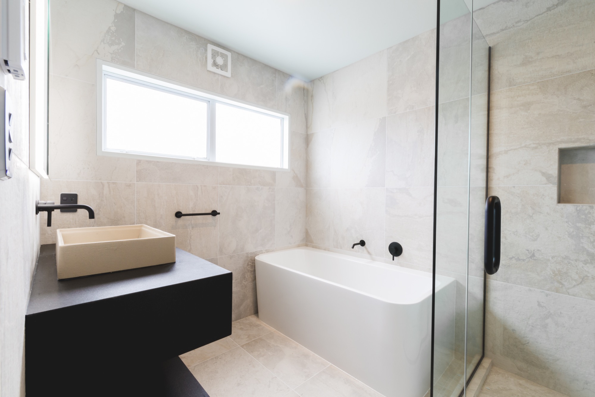 Fully tiled completed bathroom in The Woodlands TX area from our Refresh Contractors.