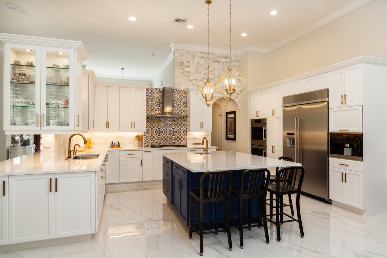 White modern kitchen with blue kitchen island