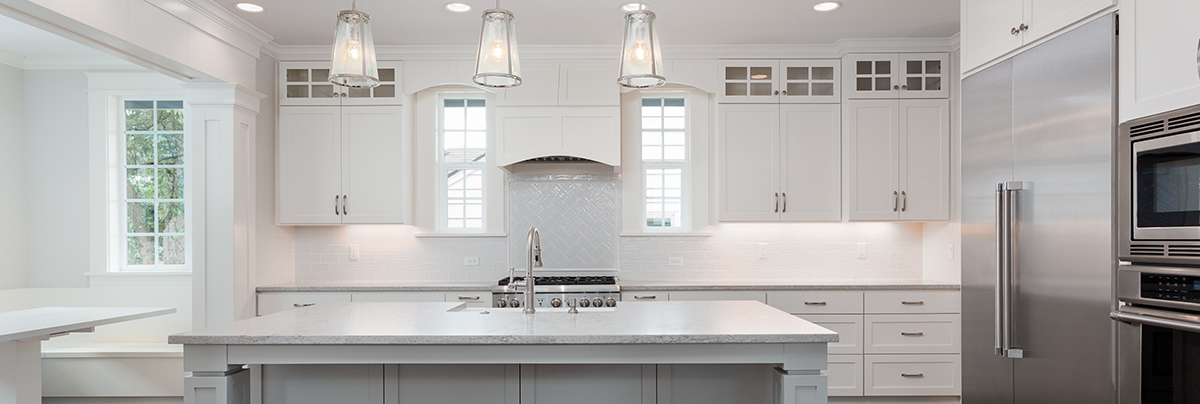Open-plan kitchen with hanging pendant lights