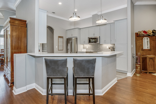 Corner kitchen with hanging pendant light
