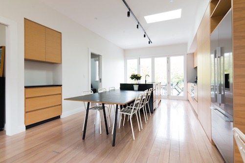 Open-plan kitchen with timber accents