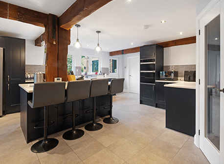 rutic kitchen with kitchen island and bar stools