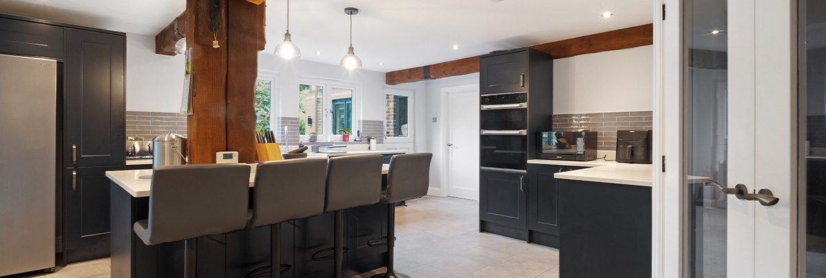 rutic kitchen with kitchen island and bar stools