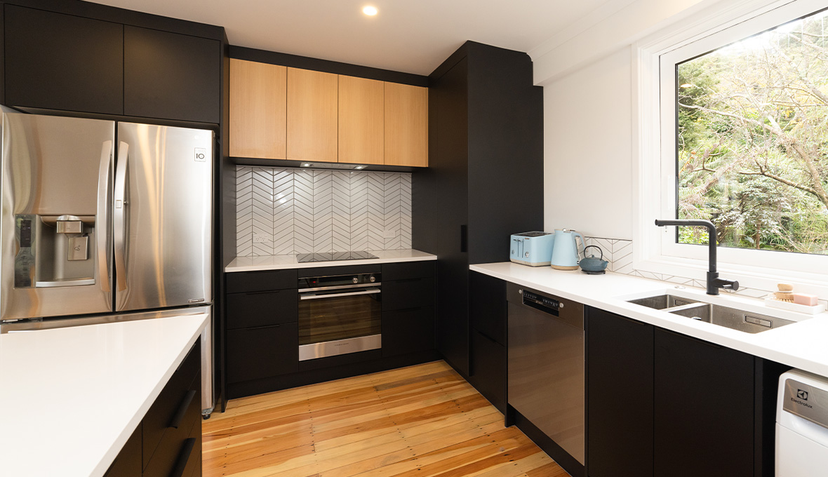 U-shaped black and timber kitchen