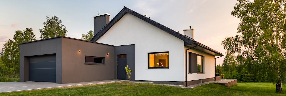 House exterior with lush green lawn