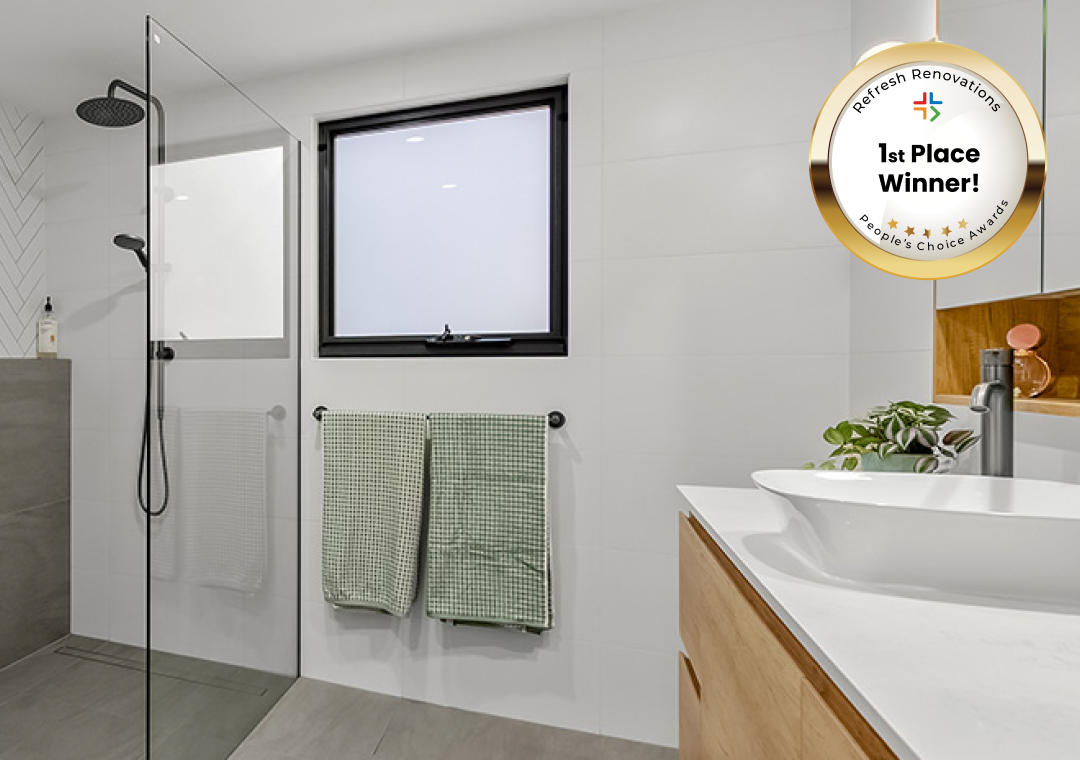 Bathroom with black fixtures and clean tiling